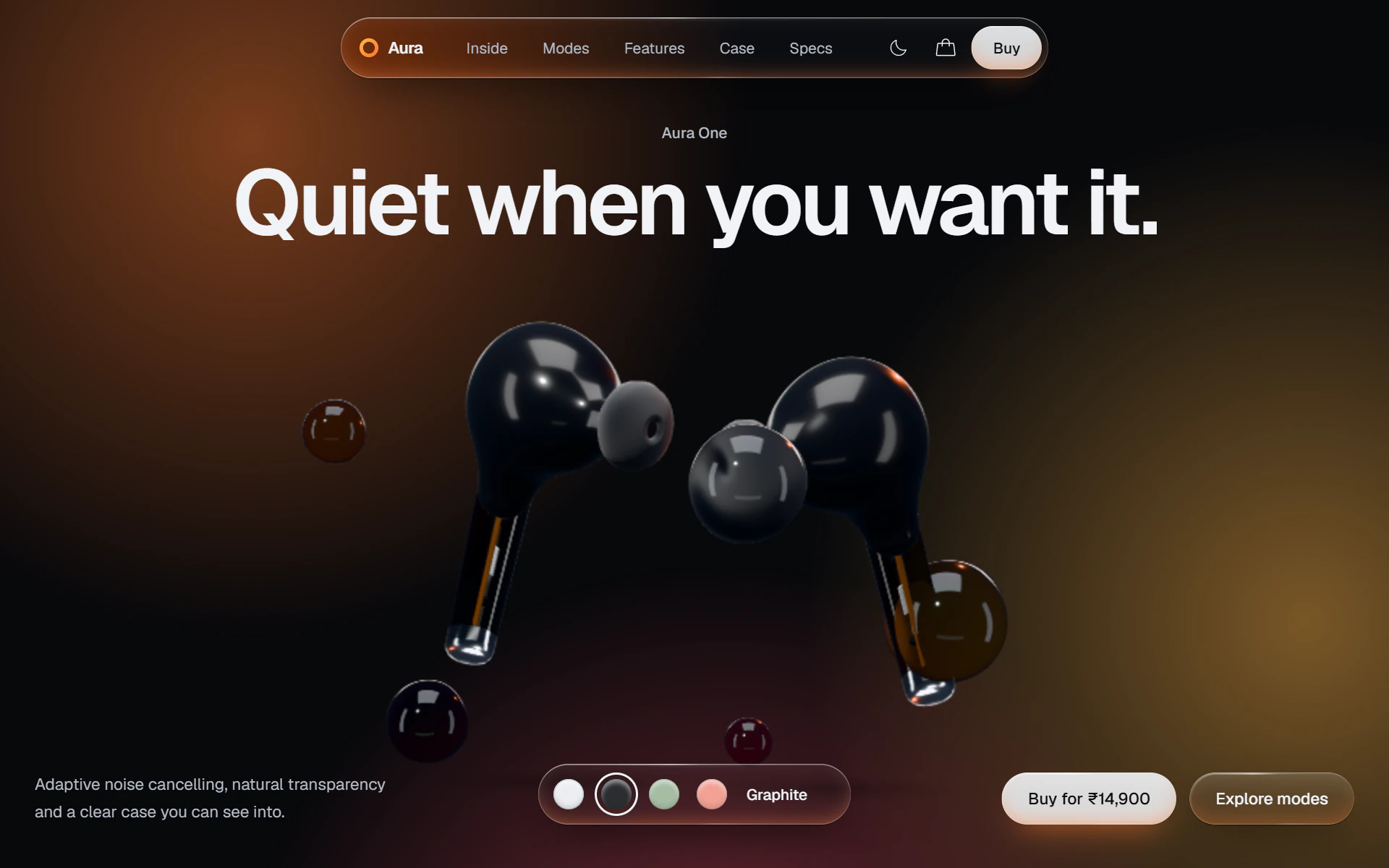Aura One in Graphite: charcoal earbuds on amber and orange light.