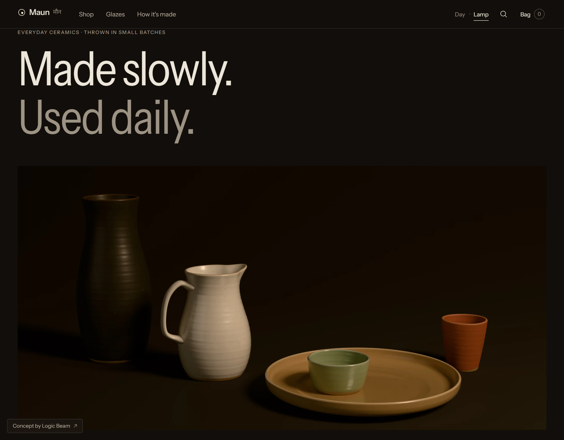 The Maun home page in Lamplight: the same headline and still life on a dark ground, the pieces lit by one warm lamp from the right.