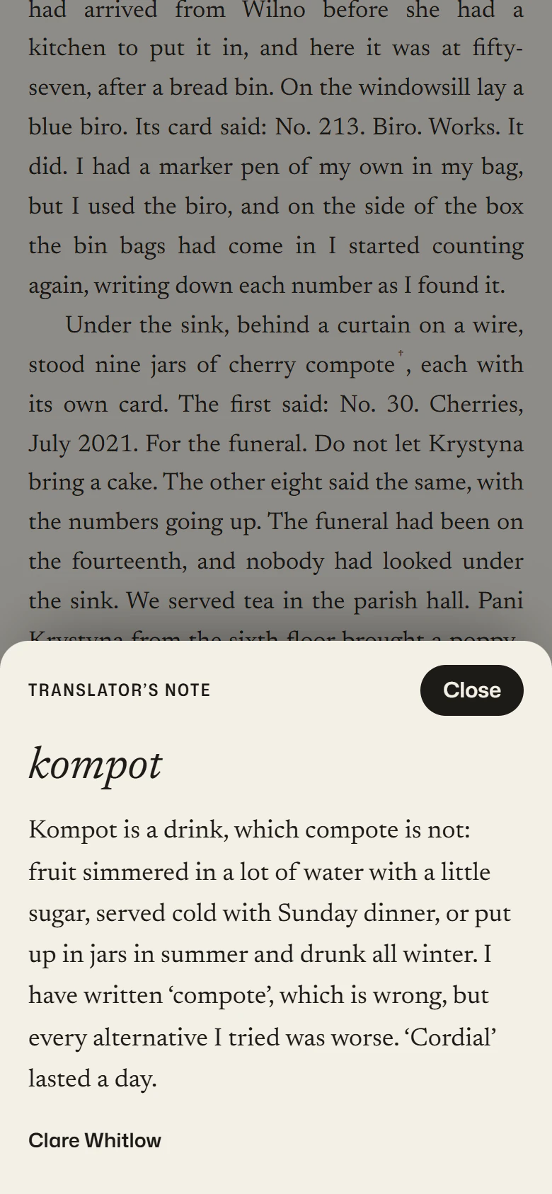A translator's note on kompot, open as a sheet over the reading room on a phone.